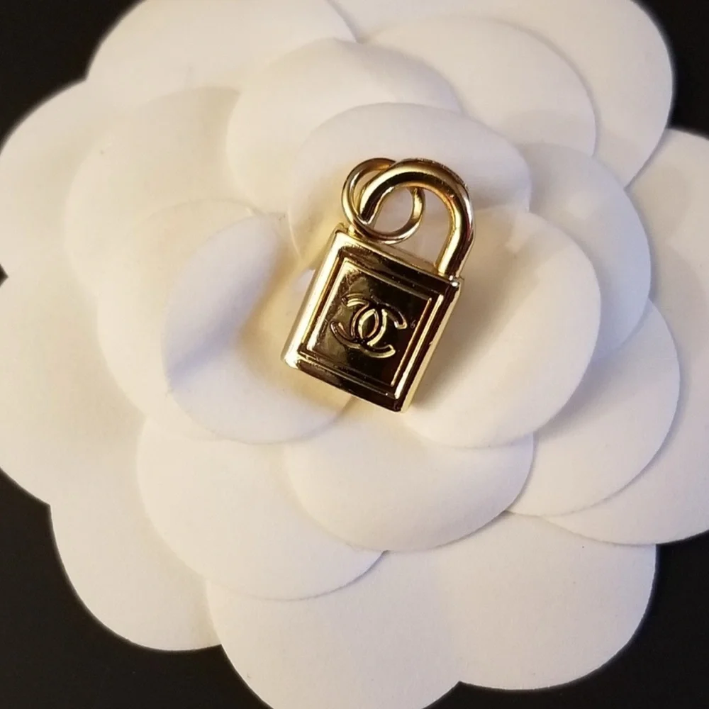 CHANEL- Gold Padlock Charm Pendant with CC Logo